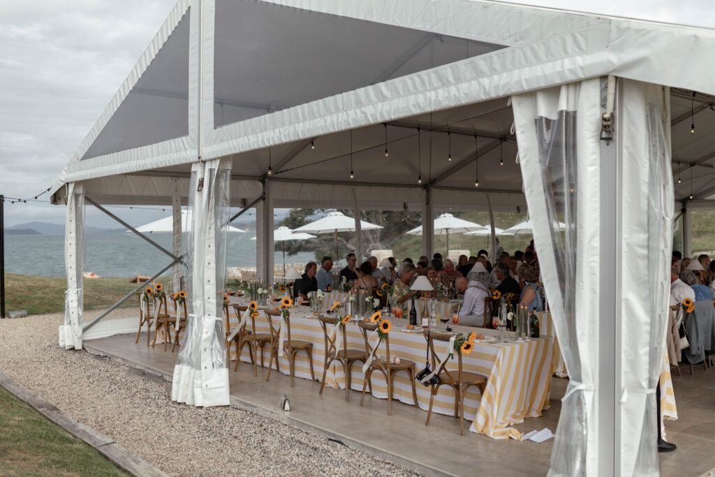 Marquee wedding reception at Baylys’ Farm wedding venue with ocean views in the Bay of Islands